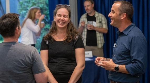 Dan Collins, the director of Lane BDC laughs with a business client at a showcase
