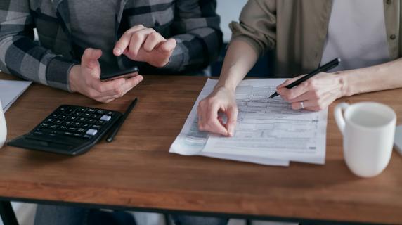 an accountant helps a person with bookkeeping