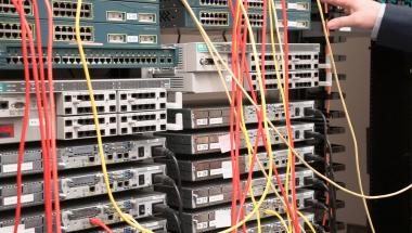 Hand reaching towards networking switches