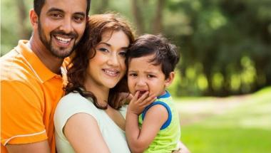 family of three hugging each other back to back