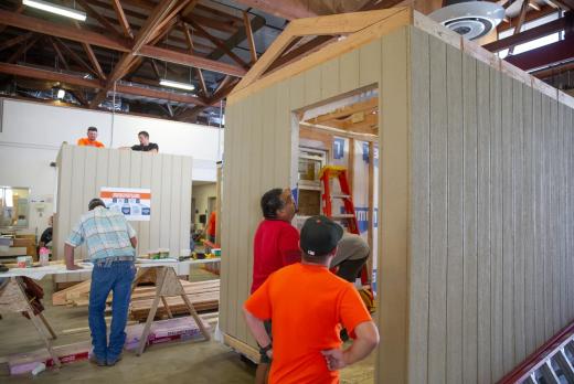 Instructors demonstrate how to build a tiny home at a Team Oregon Build event, hosted by Lane Community College.