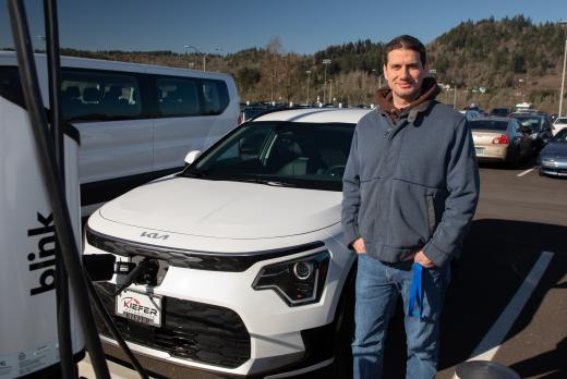 Luis Maggiore charges the newest addition to the LCC motorpool - an electric car funded by a grant through EWEB.