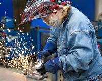 person welding with sparks flying out