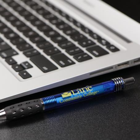 close up of laptop with an lcc-branded pen next to it